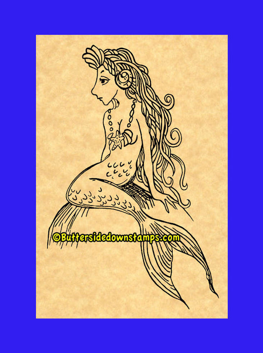 Little Mermaid sitting on rock stamp